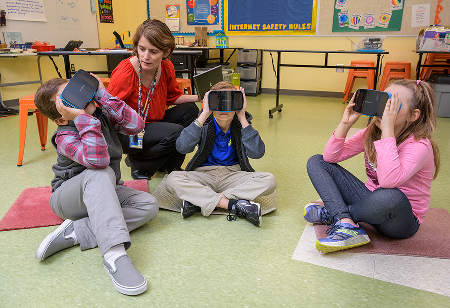 Students at The College School use virtual reality glasses