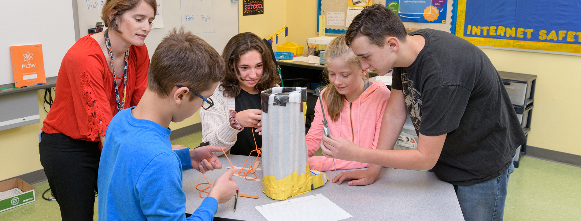 Students work on an orthopedic cast at The College School
