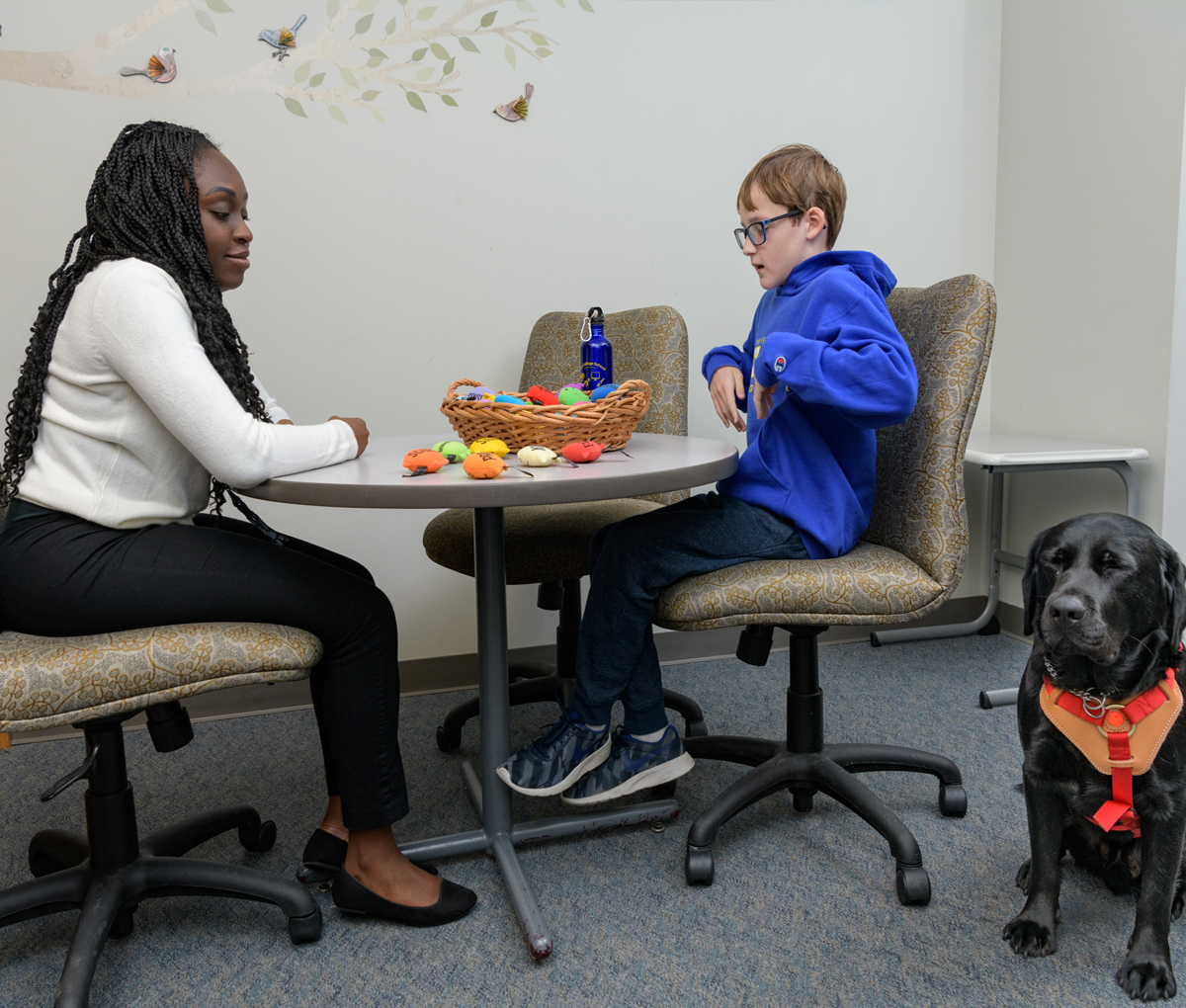 School psychologist speaks with student at The College School