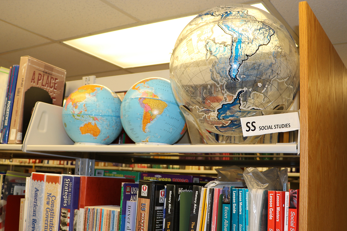 Globes and books in the Education Resource Center at UD
