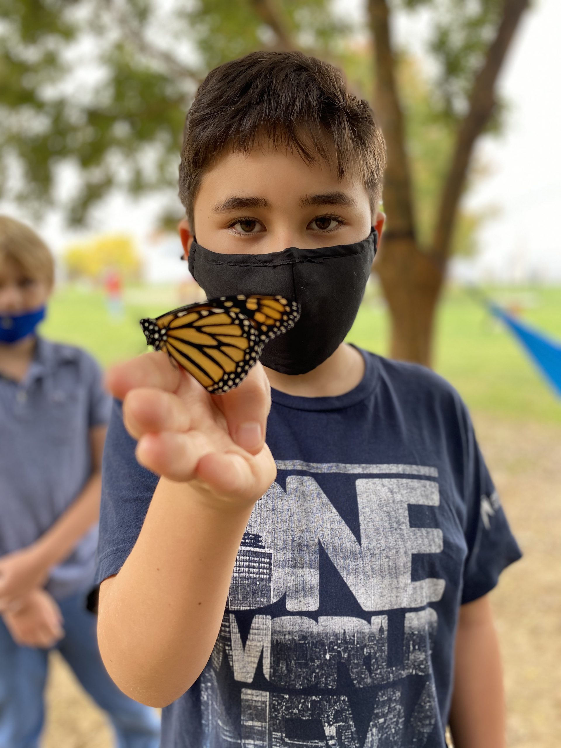 Student masked with butterfly