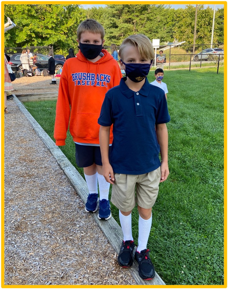 Two students standing outside of The College School