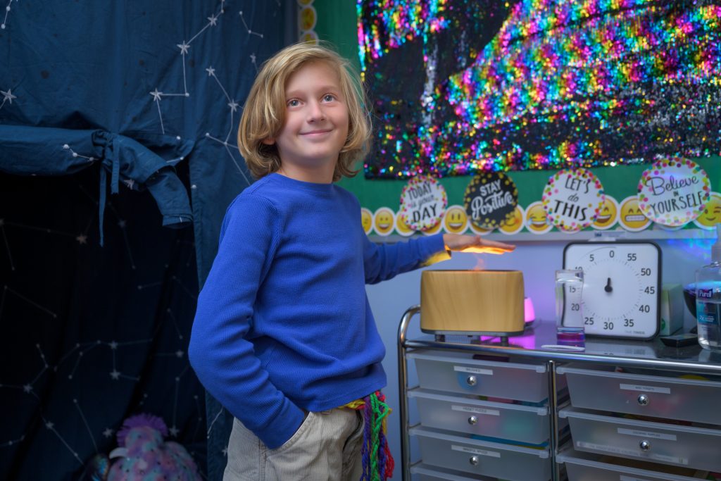 Student in sensory room at The College School smiling